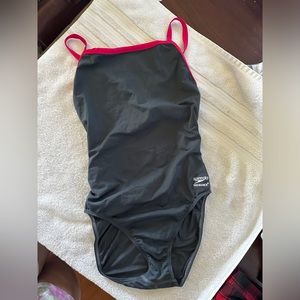 Speedo size 12 never worn. Sanitary tape not present.